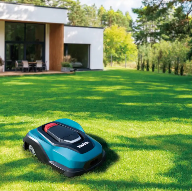 Makita RM350D robotic lawn mower in action on a residential lawn